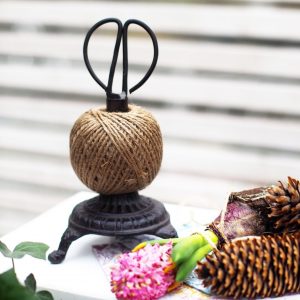 Snörhållare med sax